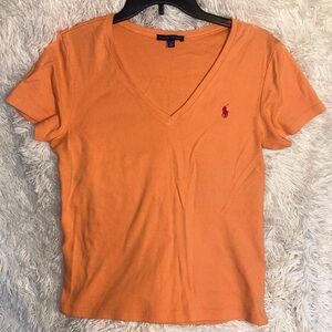Orange short sleeve v-neck polo tshirt with a hot pink logo